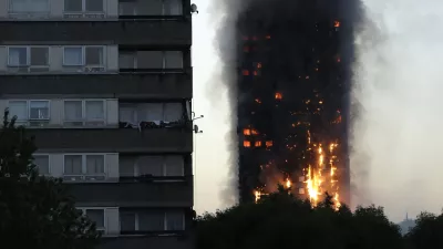 FILE - In this Wednesday, June 14, 2017 file photo smoke and flames rise from the Grenfell Tower high-rise building in west London. (AP Photo/Matt Dunham, File)