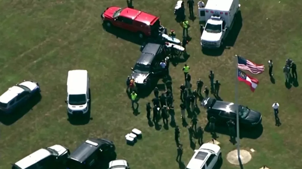 First responders gather after law enforcement officers responded to a fatal shooting at Apalachee High School in a still image from aerial video in Winder, Georgia, U.S. September 4, 2024.  ABC Affiliate WSB via REUTERS.  NO RESALES. NO ARCHIVES. MANDATORY CREDIT