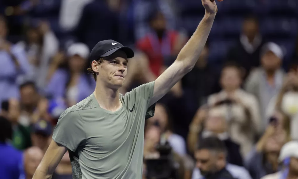 Jannik Sinner, of Italy, acknowledges the crowd after defeating Daniil Medvedev, of Russia, during the quarterfinals of the U.S. Open tennis championships, Wednesday, Sept. 4, 2024, in New York. (AP Photo/Adam Hunger)