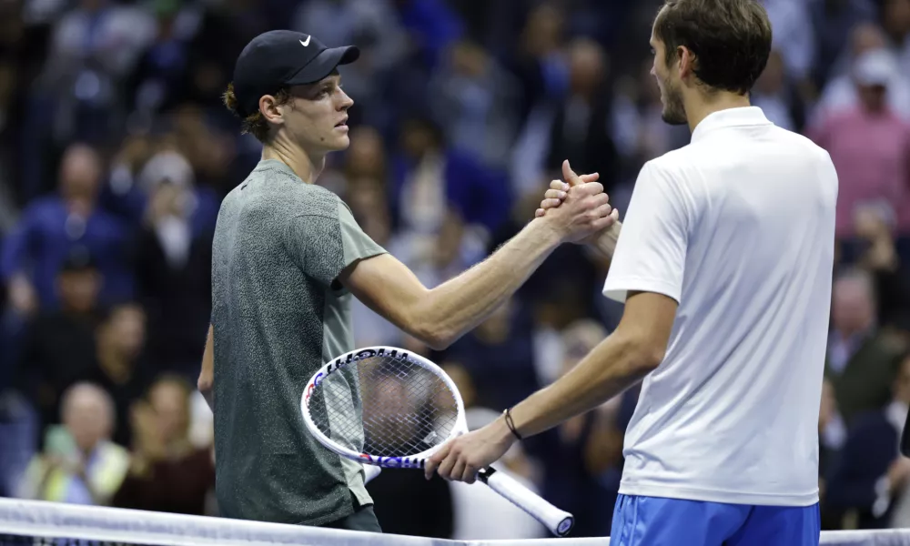 Jannik Sinner, of Italy, left, shakes hands after defeating Daniil Medvedev, of Russia, during the quarterfinals of the U.S. Open tennis championships, Wednesday, Sept. 4, 2024, in New York. (AP Photo/Adam Hunger)