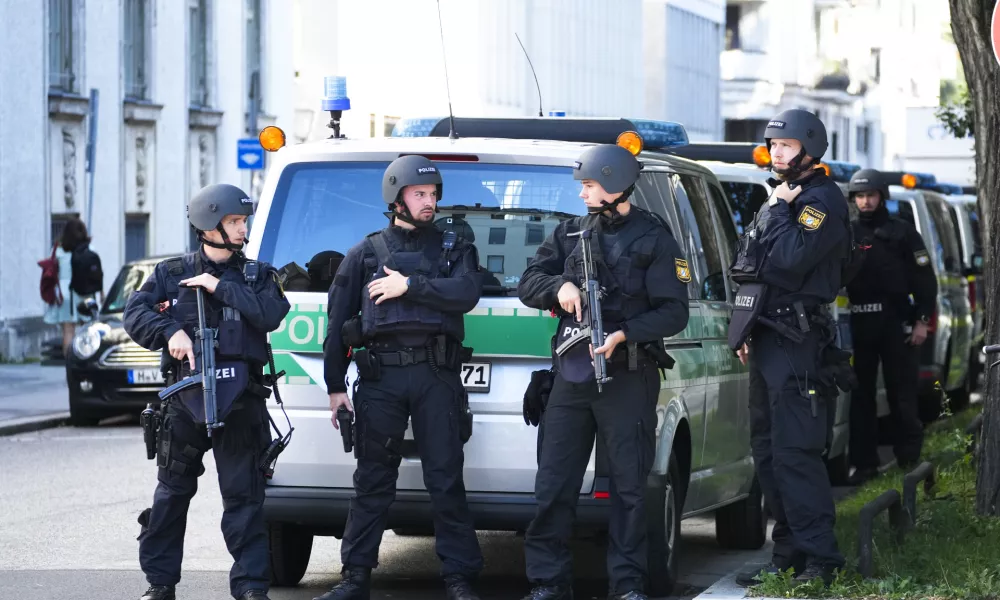 Police officers patrol after police fired shots at a suspicious person near the Israeli Consulate and a museum on the city's Nazi-era history in Munich, Germany, Thursday, Sept. 5, 2024. (AP Photo/Matthias Schrader)