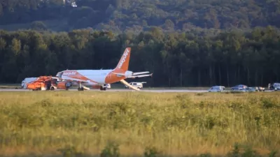 ﻿In this June 10, 2017 photo taken from video, a EasyJet plane stands at Cologne-Bonn airport, in Cologne Germany. German police are questioning three British citizens after their conversation during a flight to London prompted an EasyJet pilot to make an unscheduled stop in Cologne late Saturday. A spokesman for Cologne police says other passengers on the flight from the Slovenian capital Ljubljana overheard a conversation with "terrorist content" between the men, aged 31, 38 and 48. Airport authorities said in a statement that the 151 passengers on board disembarked the plane using emergency slides. (Thomas Kraus/dpa via AP)