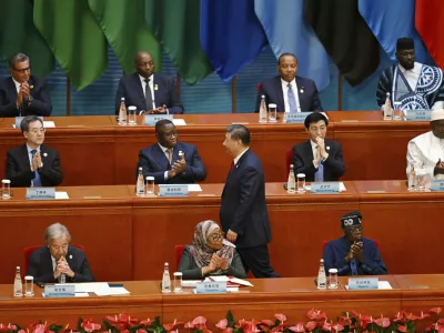 China's President Xi Jinping is applauded as he walks to the podium to speak at the opening ceremony of the Forum on China-Africa Cooperation (FOCAC) at the Great Hall of the People in Beijing, Thursday, Sept. 5, 2024. (Greg Baker/Pool Photo via AP)