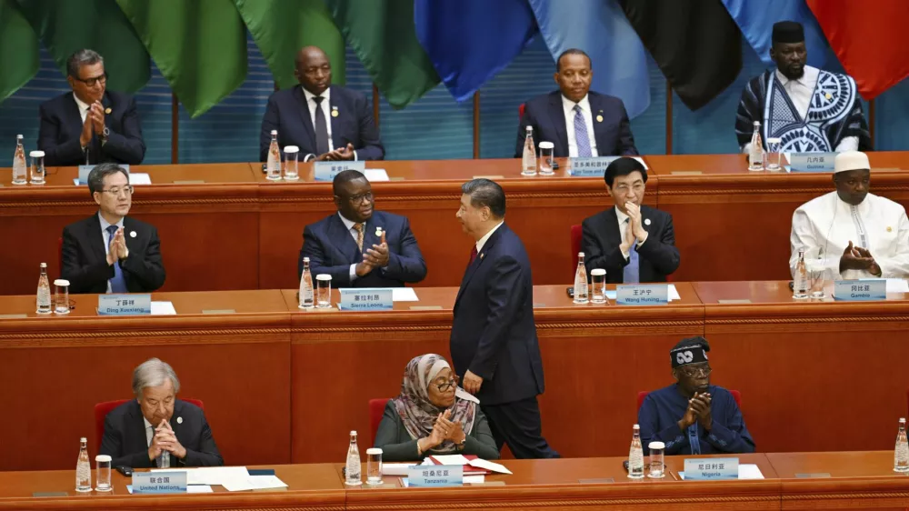 China's President Xi Jinping is applauded as he walks to the podium to speak at the opening ceremony of the Forum on China-Africa Cooperation (FOCAC) at the Great Hall of the People in Beijing, Thursday, Sept. 5, 2024. (Greg Baker/Pool Photo via AP)