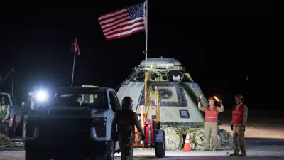 In this photo provided by NASA, Boeing and NASA teams work around NASA's Boeing Crew Flight Test Starliner spacecraft after it landed uncrewed, Friday, Sept. 6, 2024, at White Sands, New Mexico, after undocking from the International Space Station. (Aubrey Gemignani/NASA via AP)