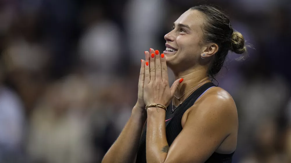 Aryna Sabalenka, of Belarus, smiles after defeating Emma Navarro, of the United States, during the women's singles semifinals of the U.S. Open tennis championships, Thursday, Sept. 5, 2024, in New York. (AP Photo/Seth Wenig)