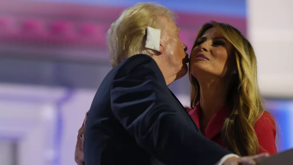 Republican presidential candidate former President Donald Trump, greets his wife, Melania Trump on stage during the Republican National Convention, Thursday, July 18, 2024, in Milwaukee. (AP Photo/Julia Nikhinson)