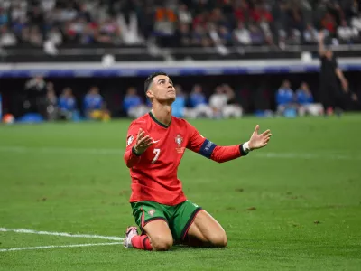 01 July 2024, Hesse, Frankfurt/Main: Portugal's Cristiano Ronaldo sits disappointed on the pitch after missing a chance to score during the UEFA Euro 2024 round of 16 football match between Portugal and Slowenien at the Frankfurt Arena. Photo: Arne Dedert/dpa