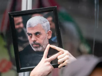 A pro-Palestinian protester holds up a portrait of Hamas leader Yahya Sinwar outside of a campaign event for Democratic presidential candidate and U.S. Vice President Kamala Harris in New York City, U.S., August 14, 2024. REUTERS/David 'Dee' Delgado