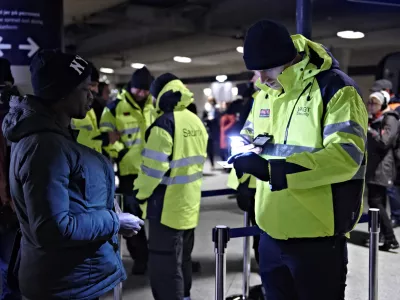 ﻿A passenger has her ID checked at the train station Copenhagen International Airport in Kastrup to prevent illegal migrants entering Sweden on Monday Jan. 4, 2016. The station is the last stop before crossing the Oresund Bridge into Sweden. Sweden requires train companies with service across a bridge-and-tunnel link from Denmark to refuse passengers without ID. (Tariq Mikkel Khan/Polfoto via AP)