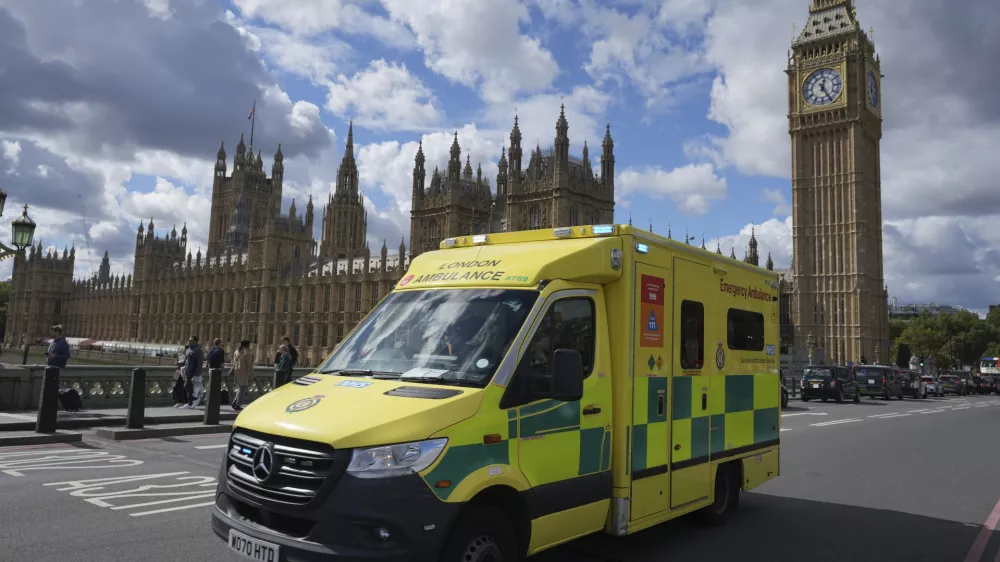 An ambulance drives along Westminster Bridge in London, as Prime Minister Keir Starmer makes a major speech on the NHS, Thursday, Sept. 12, 2024. (AP Photo/Kin Cheung)