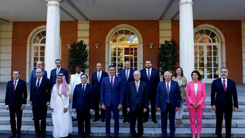 Spain's Prime Minister Pedro Sanchez poses for a family photo with Spain's Foreign Minister Jose Manuel Albares, Spain's Secretary General for Foreign Affairs Emma Aparici, European Union foreign policy chief Josep Borrell, Palestinian Prime Minister Mohammad Mustafa, Saudi Arabia's Foreign Minister Prince Faisal bin Farhan Al-Saud, Jordan's Foreign Minister Ayman Safadi, Slovenian Foreign Minister Tanja Fajon, Norway's Foreign Minister Espen Barth Eide, Turkey's Foreign Minister Hakan Fidan, Egypt's Foreign Minister Badr Abdelatty, Secretary-General of the Arab League Ahmed Aboul Gheit, Secretary-General of the Organisation of Islamic Cooperation Hissein Brahim Taha, Qatar's Minister of State Mohammed bin Abdulaziz Al-Khulaifi, Bahrain's Undersecretary of the Ministry of Foreign Affairs for Political Affairs Shaikh Abdulla bin Ahmed Al Khalifa and Ireland's UN Policy Director and Director of the UN Security Council Task Team Gerard Keown, on the day of a meeting at Moncloa Palace in Madrid, Spain, September 13, 2024. REUTERS/Susana Vera REFILE - REMOVES ID - "NIGERIA'S PERMANENT SECRETARY OF THE MINISTRY OF FOREIGN AFFAIRS DUNOMA UMAR AHMED\