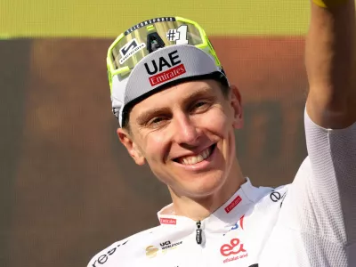 Cycling - Tour de France - Stage 20 - Nice to Col de la Couillole - Col de la Couillole, France - July 20, 2024 UAE Team Emirates' Tadej Pogacar celebrates on the podium after winning stage 20 REUTERS/Manon Cruz