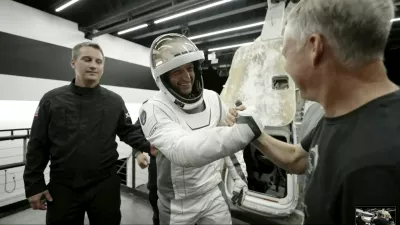 In this image made from SpaceX video, tech entrepreneur Jared Isaacman, center, greets as he gets out of its capsule upon his return with his crew after the capsule landed in the Gulf of Mexico near Florida's Dry Tortugas early Sunday, Sept. 15, 2024. (SpaceX via AP)