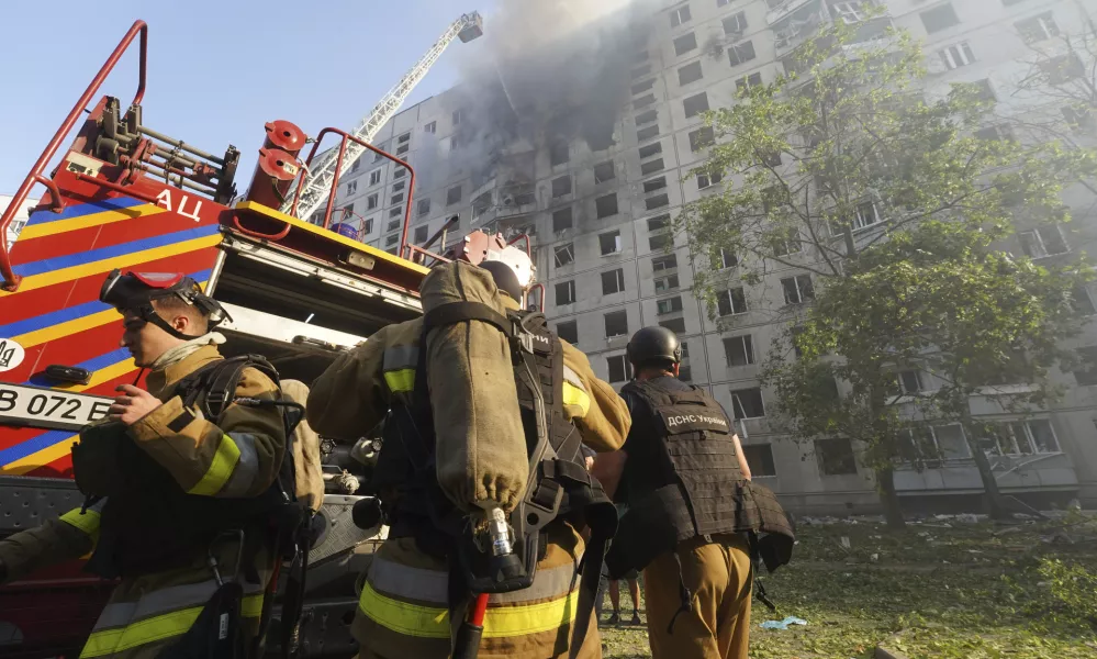 Firefighters tackle a blaze after a Russian aerial bomb struck a multi-story residential building in Kharkiv, Ukraine, Sunday Sept. 15, 2024. (AP Photo/Andrii Marienko)