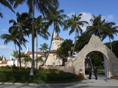 FILE - Security agents talk at the entrance to former President Donald Trump's Mar-a-Lago estate, March 31, 2023, in Palm Beach, Fla. (AP Photo/Rebecca Blackwell, File)