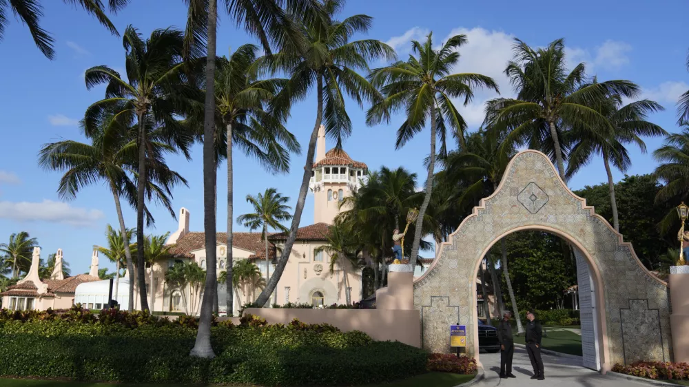 FILE - Security agents talk at the entrance to former President Donald Trump's Mar-a-Lago estate, March 31, 2023, in Palm Beach, Fla. (AP Photo/Rebecca Blackwell, File)