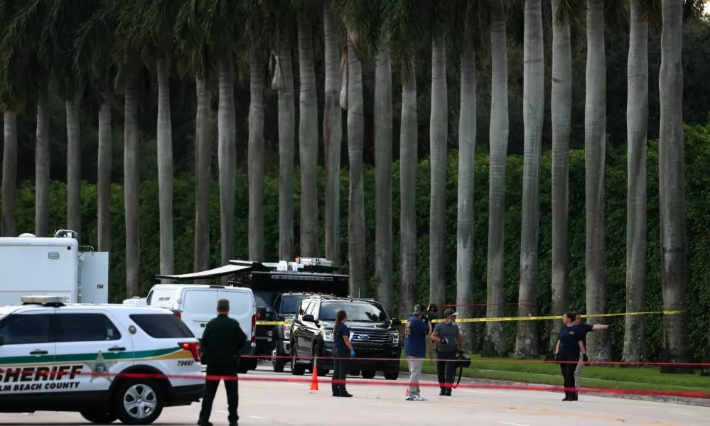 Law enforcement officers work after reports of shots fired outside Republican presidential nominee and former U.S. President Donald Trump's Trump International Golf Course in West Palm Beach, Florida, U.S. September 15, 2024. REUTERS/Marco Bello