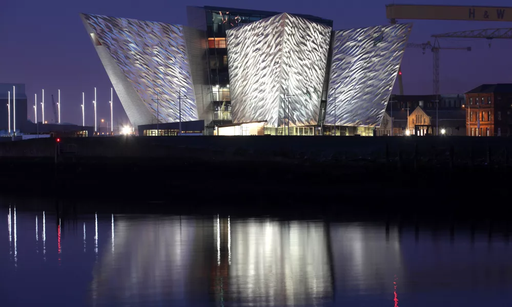 In this photo dated March 25 2012, the Titanic House Vistor Centre is reflected on Belfast Lough, Northern Ireland.  The Ł100 million (119.5 million euros; $158 million dollars) building is now finished and will open to the public on March 31. The world's biggest Titanic visitor attraction is to open in its Belfast birthplace later this month and it is 100 years to the day since the doomed ocean liner was completed in the same shipyard, Harland and Wolff. Northern Ireland hopes the eye-catching building will boost the tourism economy. (AP Photo/Peter Morrison)