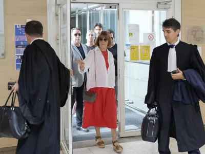 FILE - Gisele Pelicot, left, arrives in the Avignon court house, in Avignon, southern France, Thursday, Sept. 5, 2024. (AP Photo/Lewis Joly, File)