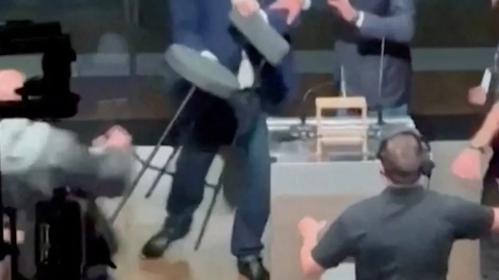 Candidate for Sao Paulo Mayor Jose Luiz Datena throws a chair at his opponent Pablo Marcal (not seen) during a televised debate, in Sao Paulo, Brazil September 15, 2024. SITE TV POP/Reuters TV via REUTERS  THIS IMAGE HAS BEEN SUPPLIED BY A THIRD PARTY. MANDATORY CREDIT. NO RESALES. NO ARCHIVES