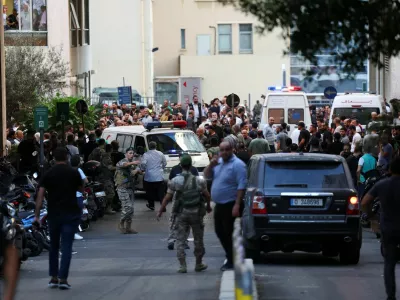 People gather outside a hospital as more than 1,000 people, including Hezbollah fighters and medics, were wounded when the pagers they use to communicate exploded across Lebanon, according to a security source, in Beirut, Lebanon September 17, 2024. REUTERS/Mohamed Azakir