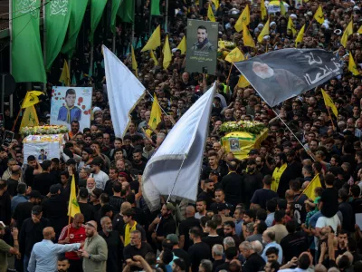 18 September 2024, Lebanon, Beirut: Hezbollah supporters carry the coffins of the victims who were killed in electronic pagers explosion, during a funeral procession in Beirut southern suburb. Thousands people were wounded in the cyberattack and 12 were killed so far in the latest toll announced by the ministry of health. Hezbollah has blamed Israel for the detonations on 17 September and promised retaliation. Several of its fighters, as well as high-ranking representatives and members of the Radwan Force, an elite unit within the group, are said to be among the victims. Photo: Marwan Naamani/dpa