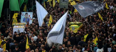 18 September 2024, Lebanon, Beirut: Hezbollah supporters carry the coffins of the victims who were killed in electronic pagers explosion, during a funeral procession in Beirut southern suburb. Thousands people were wounded in the cyberattack and 12 were killed so far in the latest toll announced by the ministry of health. Hezbollah has blamed Israel for the detonations on 17 September and promised retaliation. Several of its fighters, as well as high-ranking representatives and members of the Radwan Force, an elite unit within the group, are said to be among the victims. Photo: Marwan Naamani/dpa