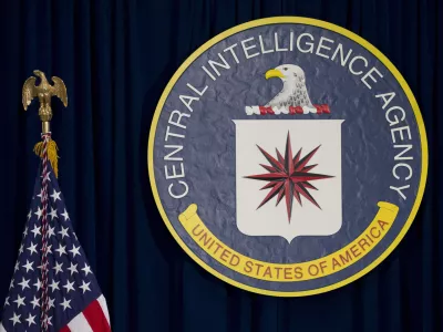 FILE - The seal of the Central Intelligence Agency stands next to a U.S. flag at CIA headquarters in Langley, Va. (AP Photo/Carolyn Kaster, File)