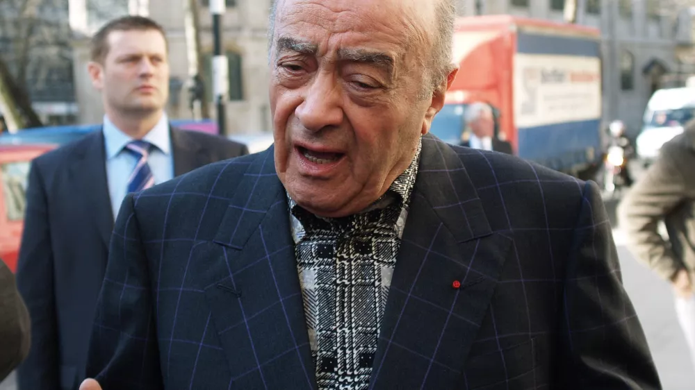 Mohamed al Fayed, the owner of the Harrods department stores gestures while making a statement outside the high court in London Wednesday March 21, 2007,before attending a preliminary hearing in the inquest into the death of his son Dodi Fayed and Princess Diana. Lawyers representing al Fayed asked a coroner Wednesday to order the police to hand over all documents and interviews from the force's three-year investigation into the deaths his son and the princess. (AP Photo/ Max Nash)