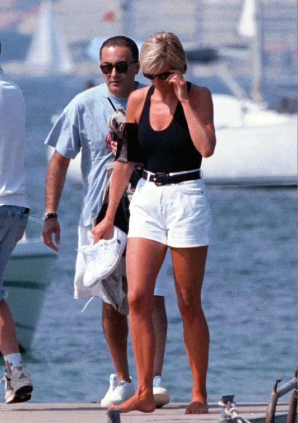 ** FILE ** Diana, Princess of Wales, and her wealthy companion Dodi Fayed, walk on a pontoon in the French Riviera resort of St Tropez in this Friday Aug. 22, 1997 file photo. A three-year inquiry into the death of Princess Diana and Dodi Fayed has concluded that allegations of murder were unfounded, and that there is no reason for suspecting the involvement of the royal family, a senior police officer said Thursday, Dec. 14, 2006. "Our conclusion is that, on all the evidence available at this time, there was no conspiracy to murder any of the occupants of the car. This was a tragic accident," said Lord John Stevens, former chief of the Metropolitan Police, who led the investigation of the deaths of Diana, 36, and her companion Dodi Fayed, 42. They were killed along with chauffeur Henri Paul when their Mercedes crashed in the Pont d'Alma tunnel in Paris on Aug. 31, 1997, while the couple was being chased by media photographers. (AP PHOTO/Patrick Bar-Nice Matin)