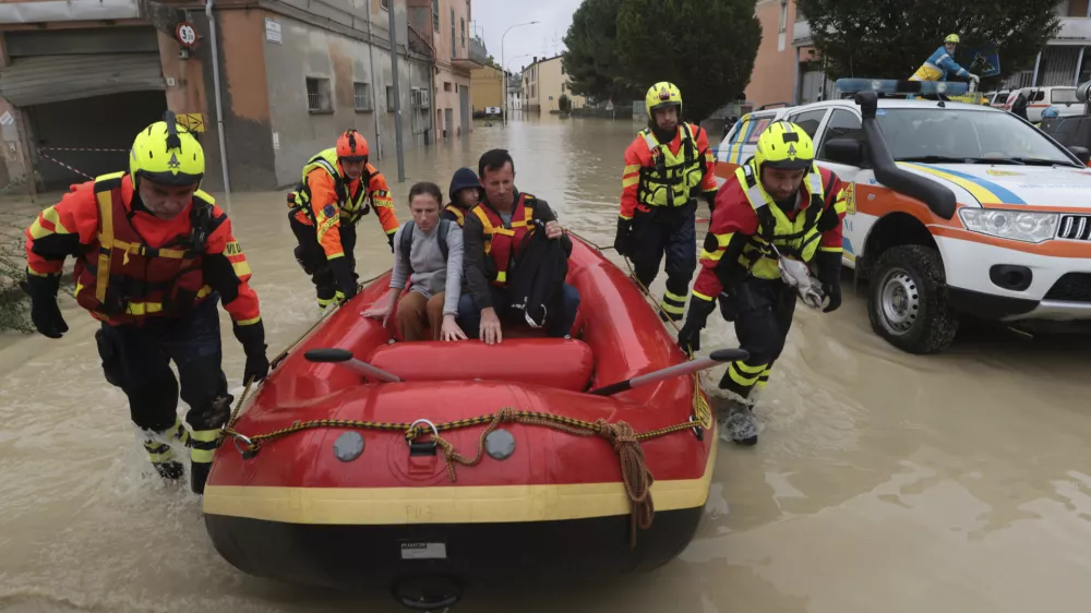 Firefighters use a dingy boat to evacuate civilians after flooding in Faenza, in the region of Emilia Romagna, Italy, Thursday, Sept. 19, 2024. (Fabrizio Zani/LaPresse via AP)