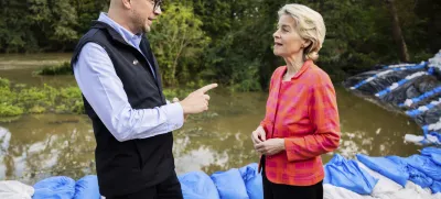 European Commmission President Ursula von der Leyen, right, talks to Jakub Mazur, First Deputy Mayor of Wroclaw, next to the river Bystrzyca near Woclaw, Poland, Thursday, Sept. 19, 2024. (Christoph Soeder/DPA via AP, Pool)