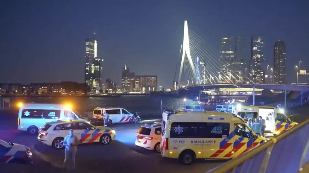 In this image made from video provided by Media TV, personnel respond to a stabbing incident late Thursday, Sept. 19, 2024, in the port city of Rotterdam, Netherlands. (Media TV via AP)