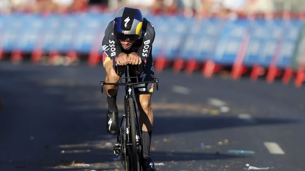 Primoz Roglic, of Slovenia, competes in the first stage of the tour of Spain, La Vuelta, cycling race, an individual time trial with start in Lisbon and finish in Oeiras, Portugal, Saturday, Aug. 17, 2024. (AP Photo/Pedro Rocha)