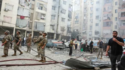 People and members of the military inspect the site of an Israeli strike in the southern suburbs of Beirut, Lebanon, September 20, 2024. REUTERS/Mohamed Azakir