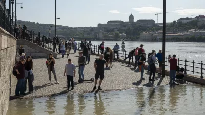 People watch the Danube river as it floods its banks in central Budapest, Hungary, Friday, Sept. 20, 2024. (AP Photo/Denes Erdos)