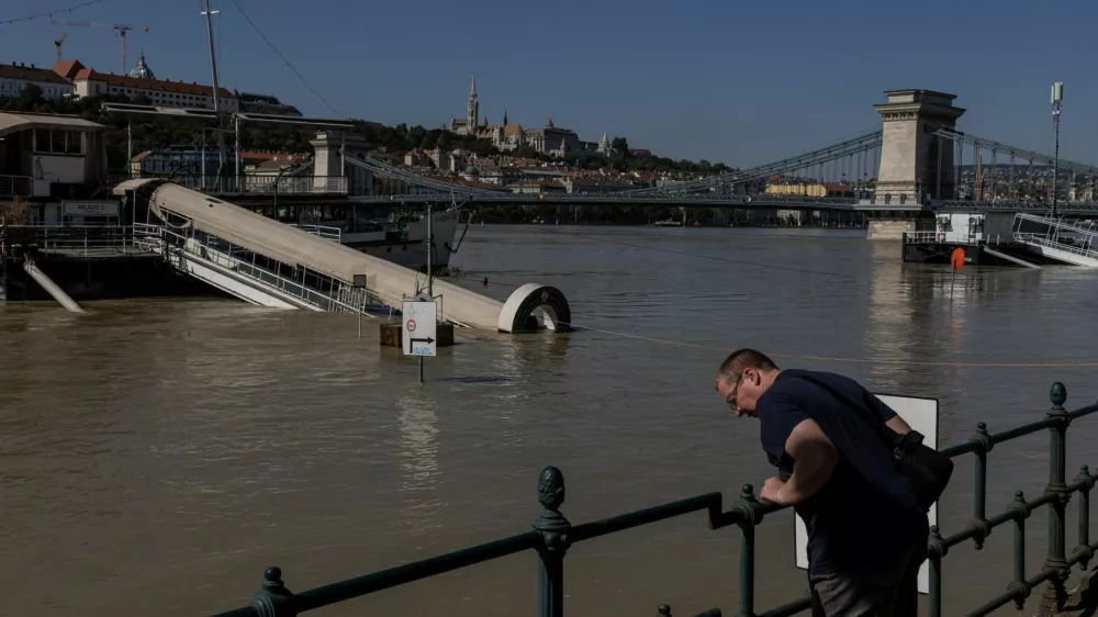 A man looks at the Danube River during flooding in Budapest, Hungary, September 21, 2024. REUTERS/Marko Djurica