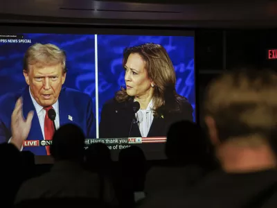 Dr. Christopher Terry's students watch the debate between Republican presidential nominee former President Donald Trump and Democratic presidential nominee Vice President Kamala Harris during a campus watch party at the University of Minnesota's Murphy Hall on Tuesday, Sept. 10, 2024, in Minneapolis. (Kerem Yücel/Minnesota Public Radio via AP)