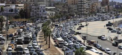 Cars sit in traffic as they flee the southern villages amid ongoing Israeli airstrikes, in Sidon, Lebanon, Monday, Sept. 23, 2024. (AP Photo/Mohammed Zaatari)