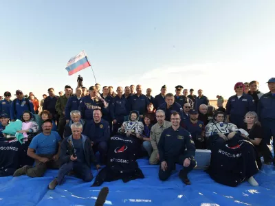 The International Space Station (ISS) crew, formed of Roscosmos cosmonauts Oleg Kononenko, Nikolai Chub and NASA astronaut Tracy Dyson, pose with ground personnel after landing in a remote area near Zhezkazgan, Kazakhstan September 23, 2024. GCTC/Roscosmos/Handout via REUTERS ATTENTION EDITORS - THIS IMAGE HAS BEEN SUPPLIED BY A THIRD PARTY. MANDATORY CREDIT.