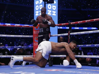 Boxing - Daniel Dubois v Anthony Joshua - IBF World Heavyweight Title - Wembley Stadium, London, Britain - September 21, 2024 Anthony Joshua gets knocked down by Daniel Dubois Action Images via Reuters/Andrew Couldridge