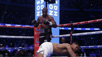 Boxing - Daniel Dubois v Anthony Joshua - IBF World Heavyweight Title - Wembley Stadium, London, Britain - September 21, 2024 Anthony Joshua gets knocked down by Daniel Dubois Action Images via Reuters/Andrew Couldridge