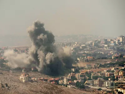 Smoke rises from Israeli airstrikes in the southern village of Kfar Rouman, seen from Marjayoun, south Lebanon, Wednesday, Sept. 25, 2024. (AP Photo/Hussein Malla)