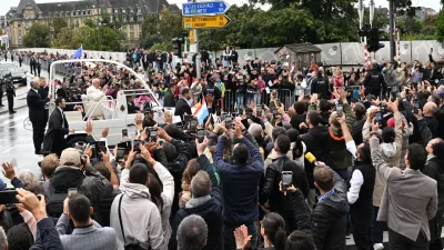 26 September 2024, Luxembourg: Pope Francis waves to the people while traveling in the Popamobile during his visit to Luxembourg. Photo: Harald Tittel/dpa