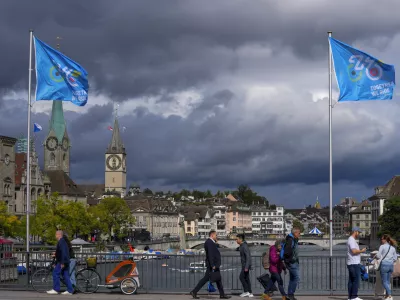 World Championships flags fly over the historic city center during the Cycling and Para-cycling Road World Championships in Zurich, Switzerland, Friday, Sept. 27, 2024. (AP Photo/Peter Dejong)