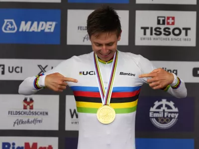 Slovenia's Tadej Pogacar wearing the World Champion's rainbow jersey reacts after winning the Men Elite road race of the Cycling and Para-cycling Road World Championships in Zurich, Switzerland, Sunday, Sept. 29, 2024. (AP Photo/Peter Dejong)