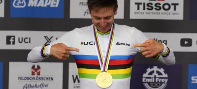 Slovenia's Tadej Pogacar wearing the World Champion's rainbow jersey reacts after winning the Men Elite road race of the Cycling and Para-cycling Road World Championships in Zurich, Switzerland, Sunday, Sept. 29, 2024. (AP Photo/Peter Dejong)