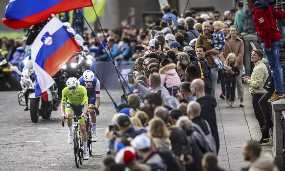 Gold medalist Slovenia's Tadej Pogacar, front, competes during the Men Elite road race of the Cycling and Para-cycling Road World Championships in Zurich, Switzerland, Sunday, Sept. 29, 2024. (Michael Buholzer/Keystone via AP)