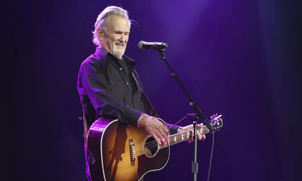 FILE - Artist and songwriter Kris Kristofferson performs "Sunday Morning Coming Down" at the Nashville Songwriters Association International "50 Years of Songs" at the Ryman Auditorium, Sept. 20, 2017, in Nashville, Tenn. (Photo by Laura Roberts/Invision/AP, File)